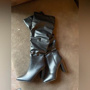 Black over the knee high heeled boots